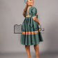 Kwena Pleated Yele Dress In Bottle Green